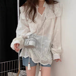 White Eyelet Blouse with Embroidery and Tussles