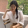 White Ruffled V Neck Blouse