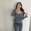 Long Sleeve Tie-Front Smocked Peplum Blouse